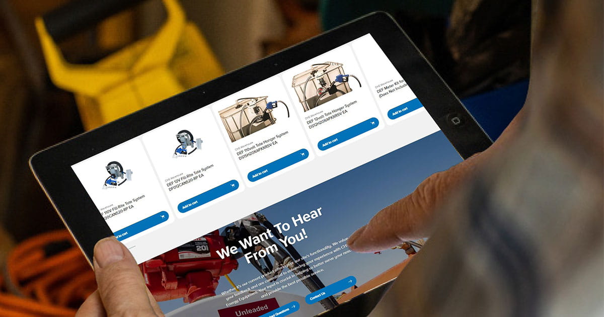 hands holding a tablet with a website shown