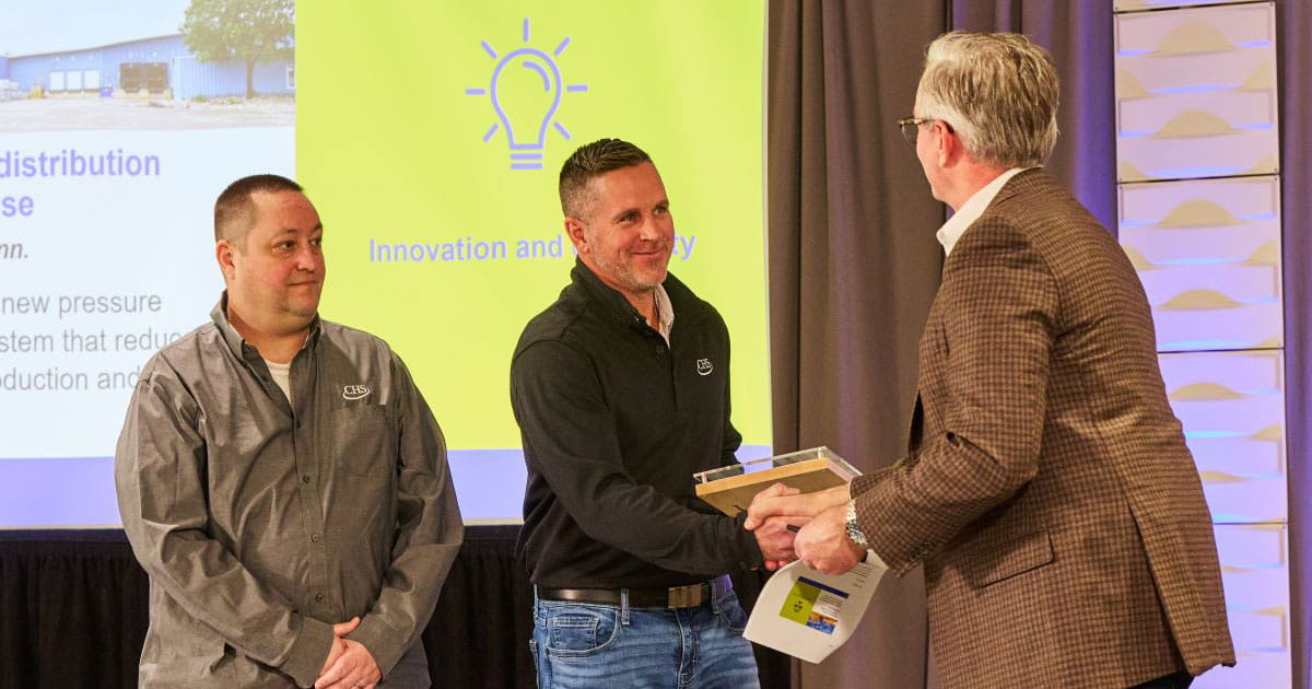 Men shaking hands as they receive Safety Excellence Award