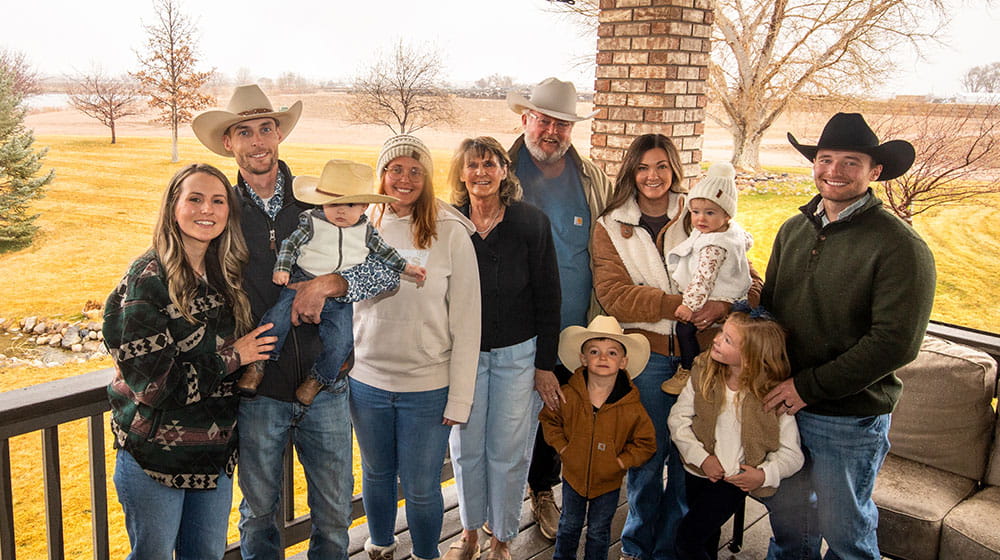 Family standing on a porch.