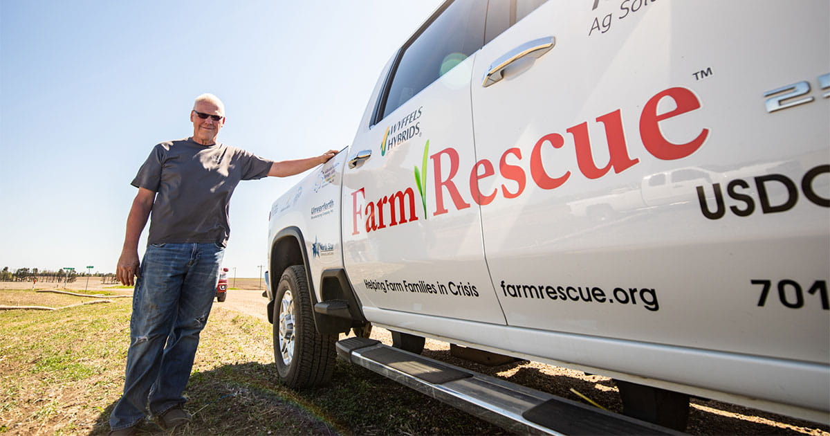 Man standing by pickup truck