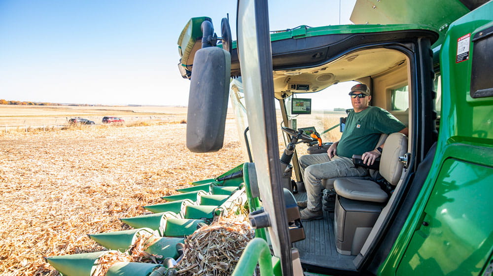 Farmer sitting in a combine in a field
