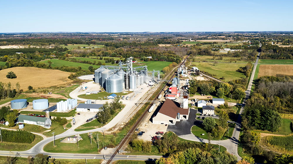 Aerial photo of a cooperative with a town in the background