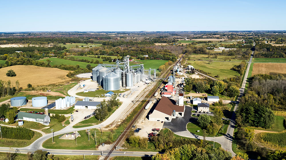 Aerial photo of a cooperative with a town in the background