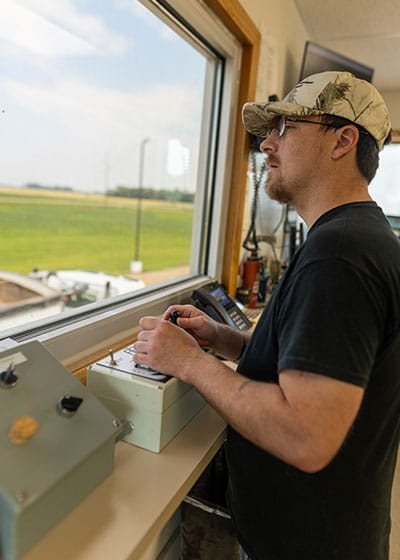 Man checking grain samples