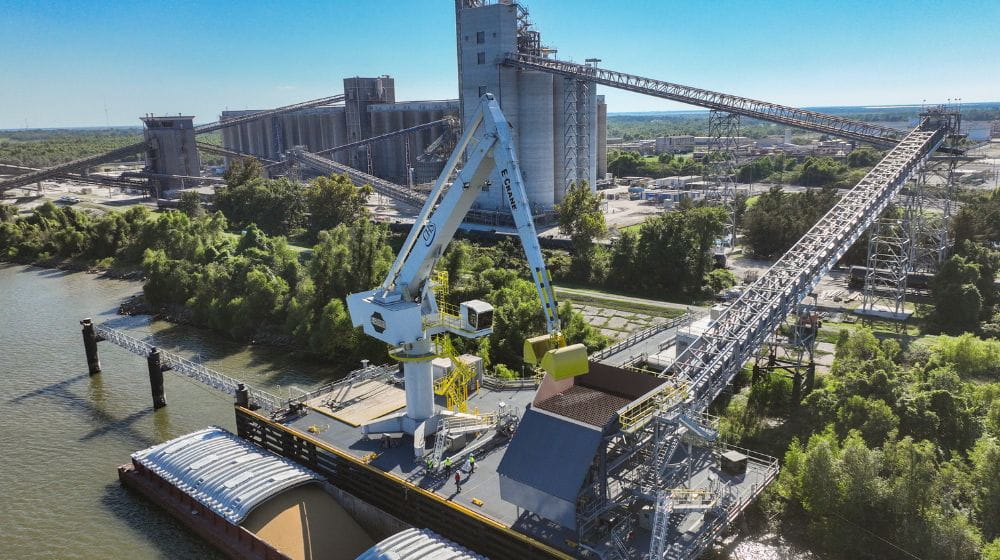 A crane unloading a barge