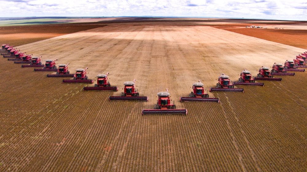 Group of combines harvesting a field in Brazil 