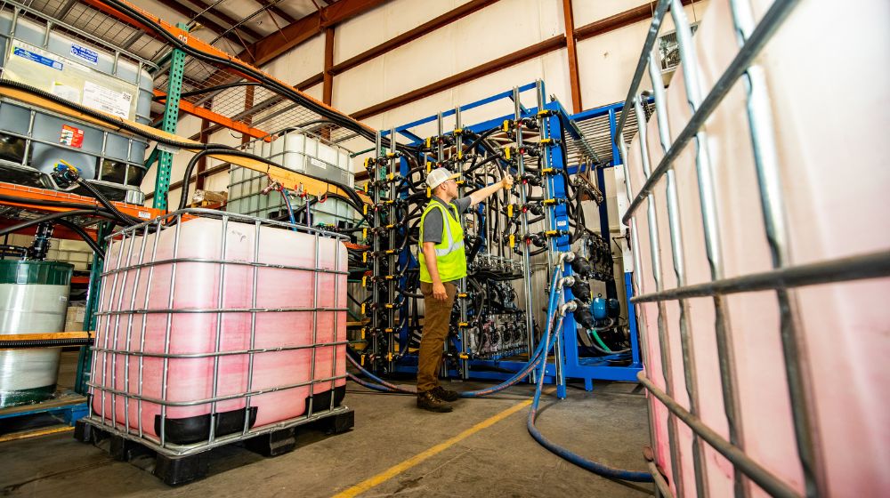 Man working on a seed treatment blender