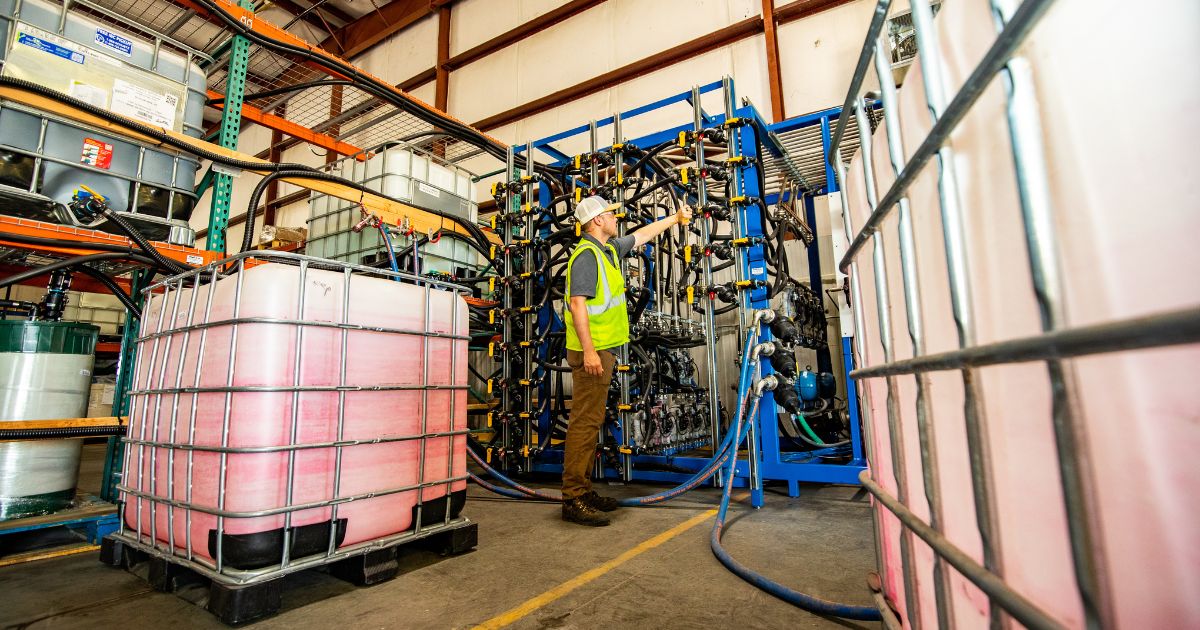 Man working on a seed treatment blender