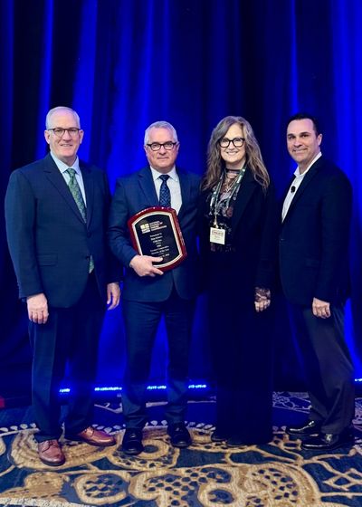 Dan Schurr receives the 2026 Farmer Cooperative Director of the Year award from the National Council of Farmer Cooperatives (NCFC). From left, Kevin Brinkley, NCFC chair, Dan Schurr, Karen Schurr and Duane Simpson, NCFC president and CEO.